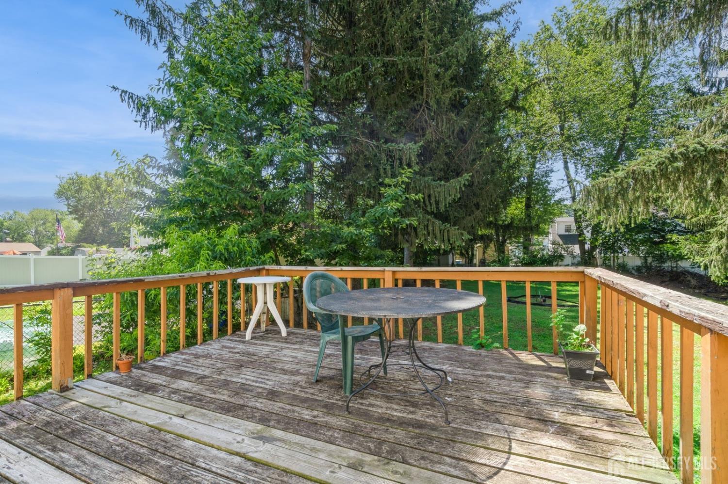 571 Greenbrook Road North Plainfield, NJ 07063 - Photo 7 of 28 a balcony with wooden floor and outdoor space