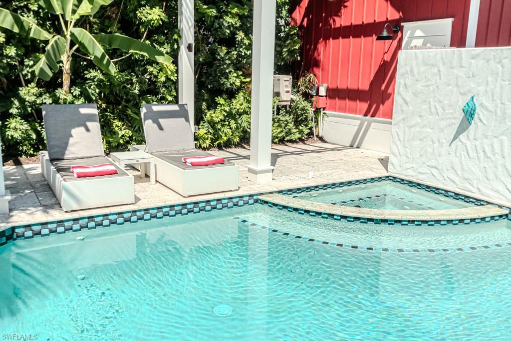 245 Broad Avenue South Naples, FL 34102 - Photo 11 of 50 swimming pool view with a backyard space