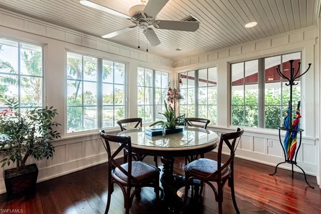 a view of a dining room with furniture window and wooden floor