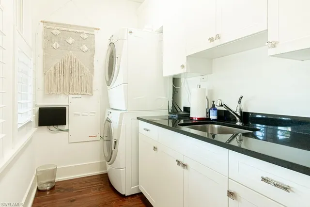 a kitchen with a sink and a refrigerator