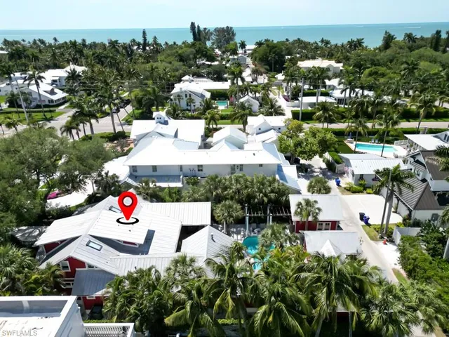 an aerial view of a house with yard swimming pool and outdoor seating