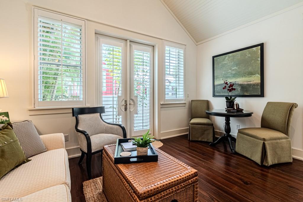 245 Broad Avenue South Naples, FL 34102 - Photo 44 of 50 a living room with furniture and a window