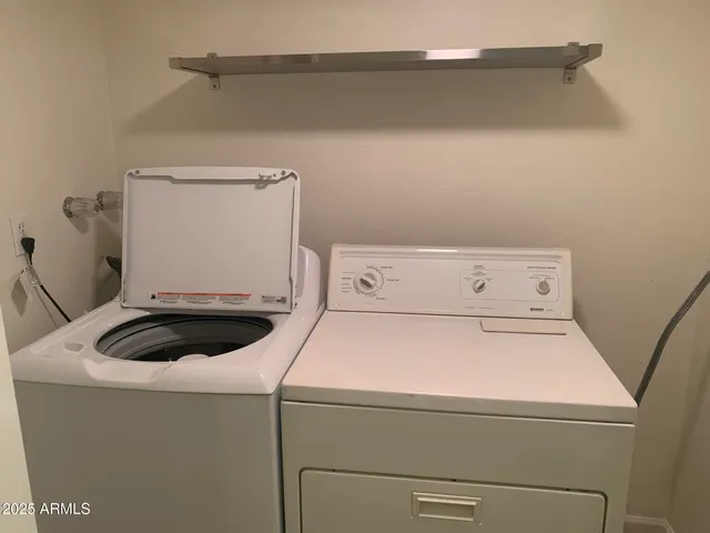 a utility room with dryer and washer