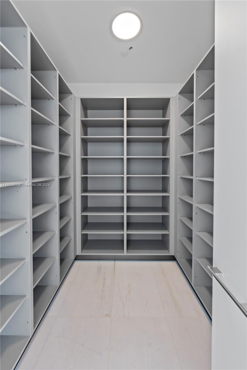 300 Biscayne Blvd Way, Unit 3201 Miami, FL 33131 - Photo 12 of 42 a view of walk in closet with empty racks