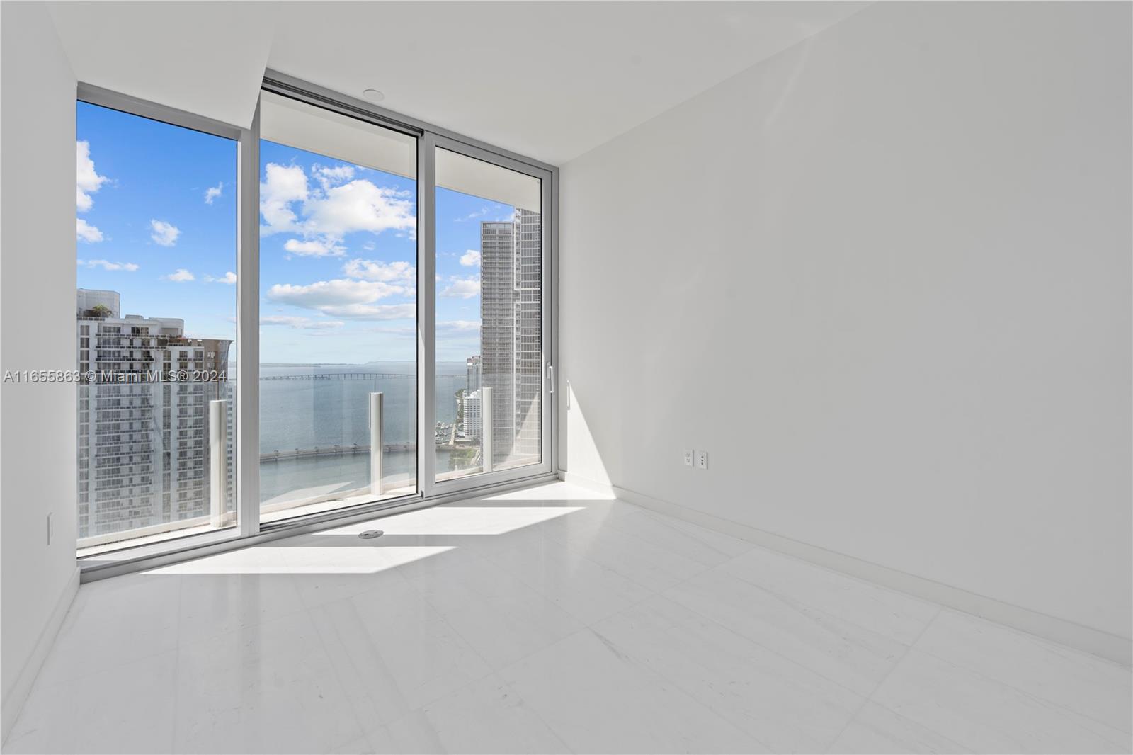 300 Biscayne Blvd Way, Unit 3201 Miami, FL 33131 - Photo 21 of 42 a view of empty room with floor to ceiling window
