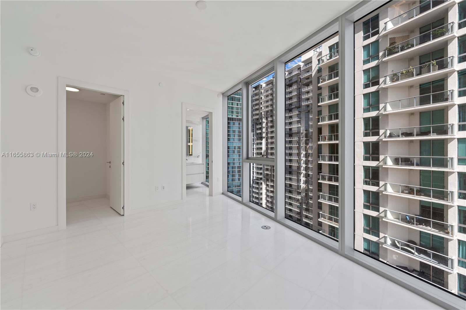 300 Biscayne Blvd Way, Unit 3201 Miami, FL 33131 - Photo 24 of 42 a view of an empty room with windows