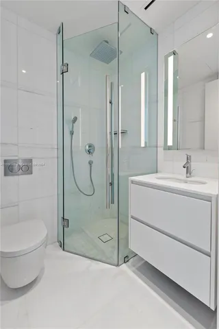 a balcony with dining table and chairs