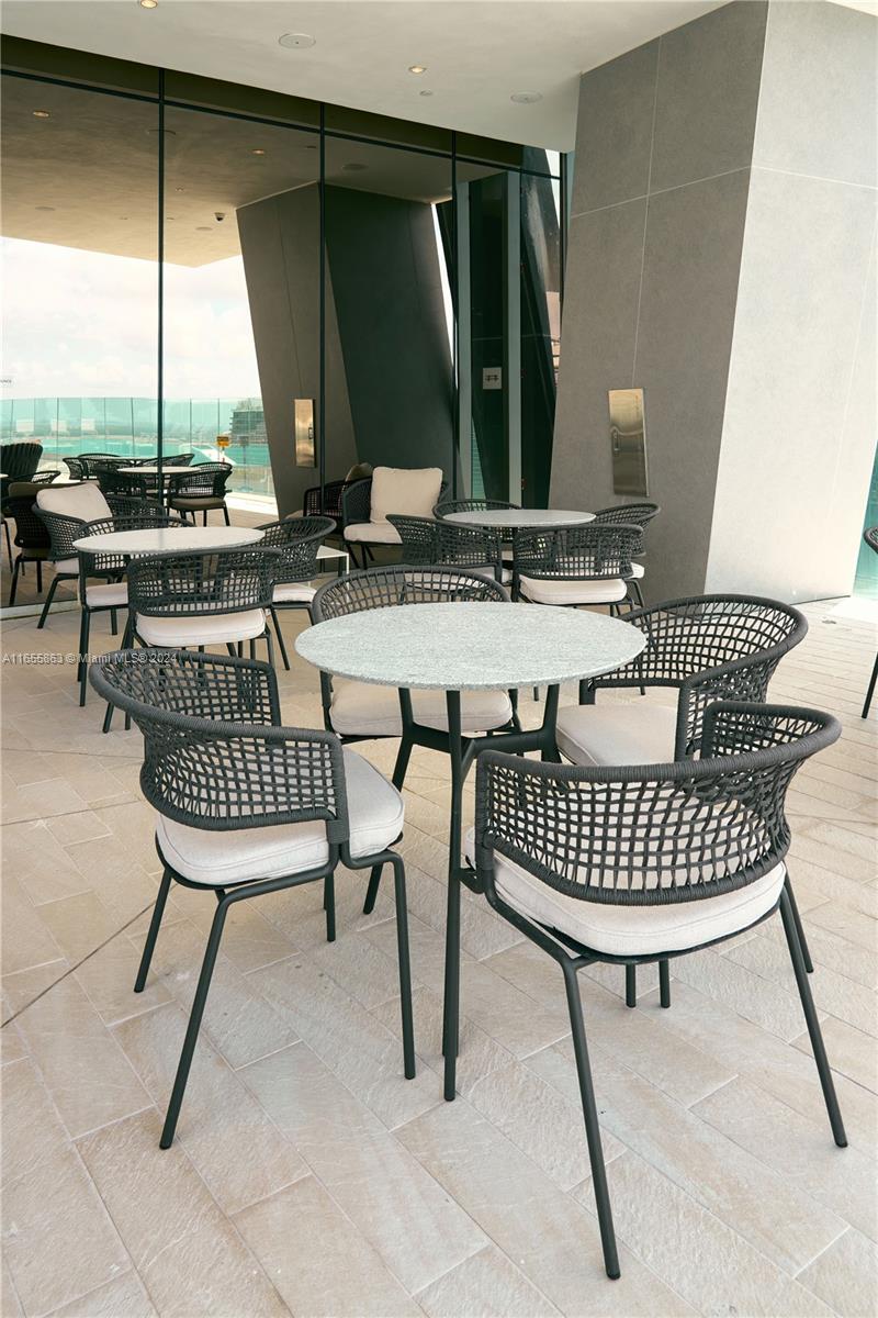 300 Biscayne Blvd Way, Unit 3201 Miami, FL 33131 - Photo 36 of 42 a view of a chairs and table in the balcony