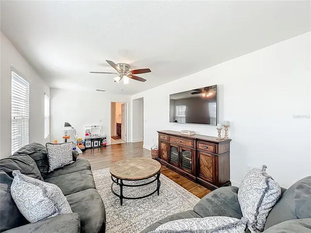 a bathroom with a granite countertop sink a mirror and a shower