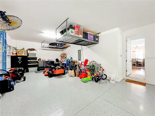 an aerial view of residential houses with outdoor space and ocean view