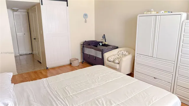 a bedroom with a bed and a mirror