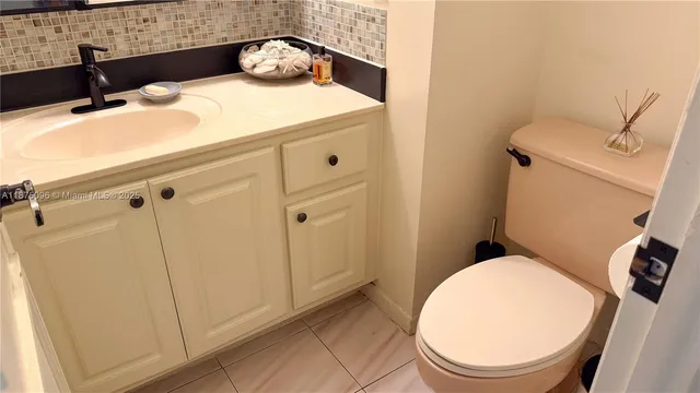 a bathroom with a sink and toilet