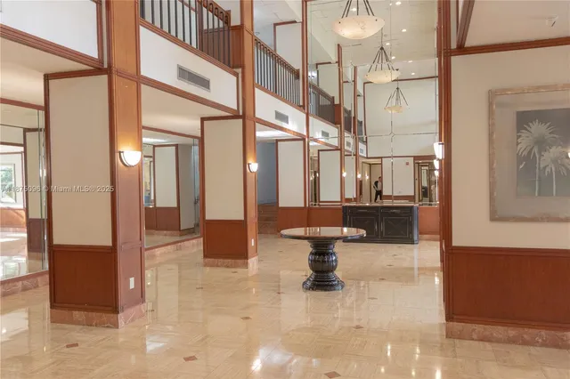 a lobby with furniture and rug