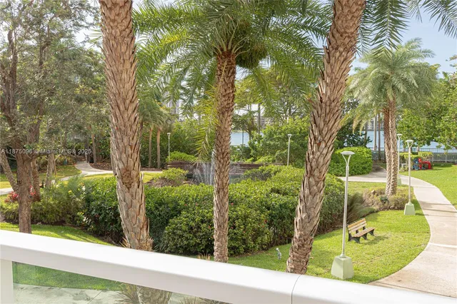 a view of a white house with a patio