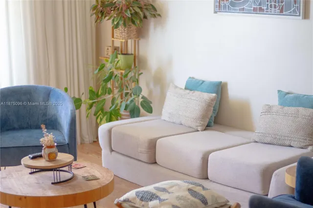 a bedroom with bed and a potted plant