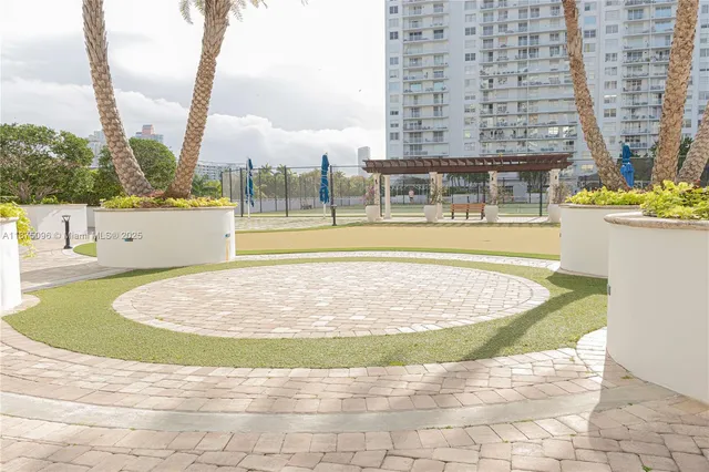 a view of a house with swimming pool and sitting area