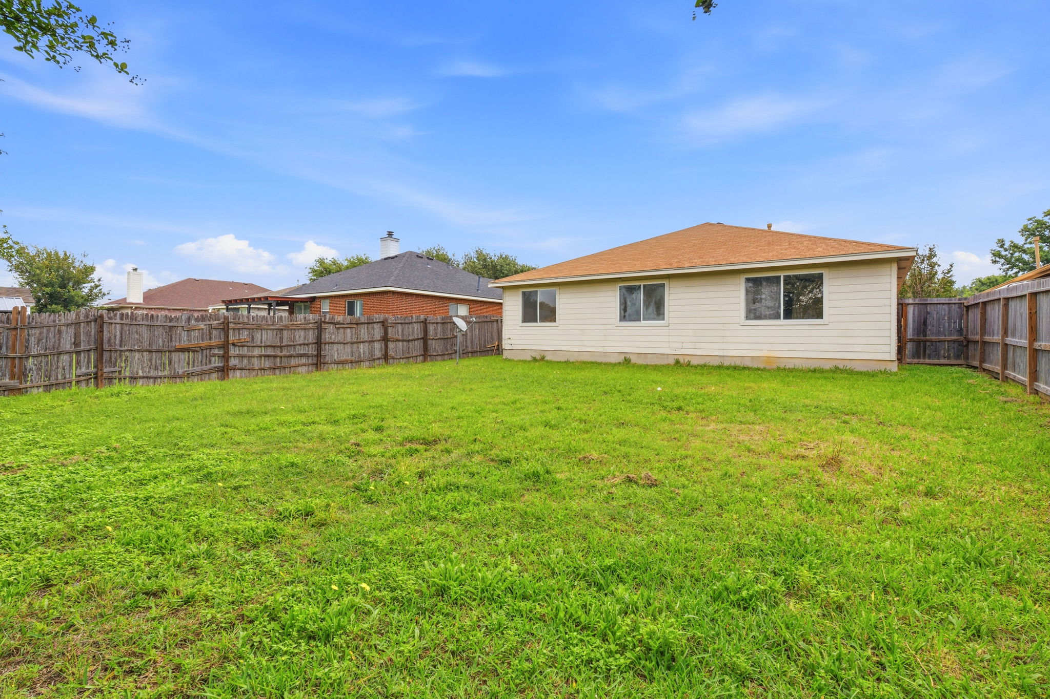 116 Blue Ridge Trail Elgin, TX 78621 - Photo 27 of 28 a view of a house with a yard and sitting area