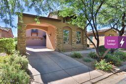9265 East Canyon View Road Scottsdale, AZ 85255 - Photo 1 of 39 a front view of a house with garden