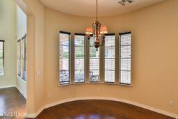 9265 East Canyon View Road Scottsdale, AZ 85255 - Photo 13 of 39 a view of a room with a window and wooden floor