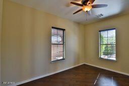 9265 East Canyon View Road Scottsdale, AZ 85255 - Photo 16 of 39 an empty room with windows and fan
