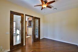 9265 East Canyon View Road Scottsdale, AZ 85255 - Photo 17 of 39 wooden floor in an empty room with a window