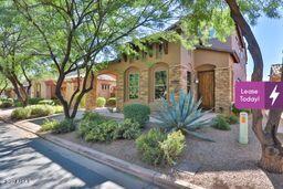 9265 East Canyon View Road Scottsdale, AZ 85255 - Photo 2 of 39 a front view of a house with garden
