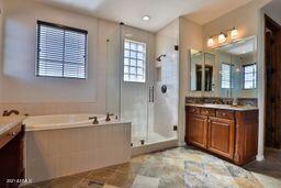 9265 East Canyon View Road Scottsdale, AZ 85255 - Photo 27 of 39 a bathroom with a sink and a mirror