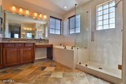 9265 East Canyon View Road Scottsdale, AZ 85255 - Photo 29 of 39 a large kitchen with cabinets
