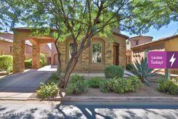 9265 East Canyon View Road Scottsdale, AZ 85255 - Photo 3 of 39 a front view of a house with garden