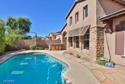 9265 East Canyon View Road Scottsdale, AZ 85255 - Photo 34 of 39 a view of a house with a yard