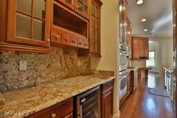 9265 East Canyon View Road Scottsdale, AZ 85255 - Photo 7 of 39 a view of a bathroom with a sink and a wooden floor