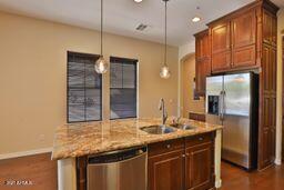 9265 East Canyon View Road Scottsdale, AZ 85255 - Photo 10 of 39 a bathroom with a granite countertop sink and a mirror