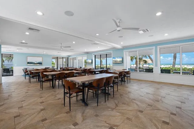 a living room with lots of furniture and a large window