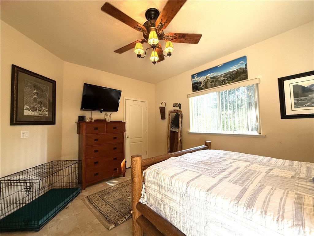 3502 Comet Mine Mariposa, CA 95338 - Photo 32 of 47 a bedroom with a bed and a flat screen tv