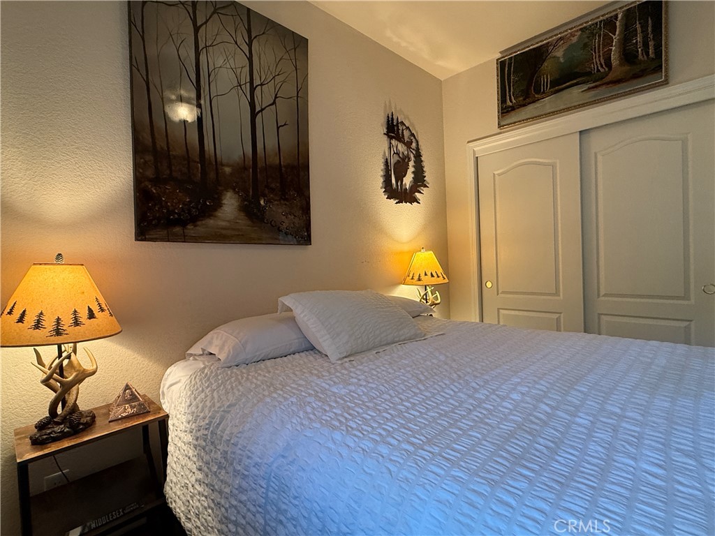 3502 Comet Mine Mariposa, CA 95338 - Photo 39 of 47 a bedroom with a bed and cabinets