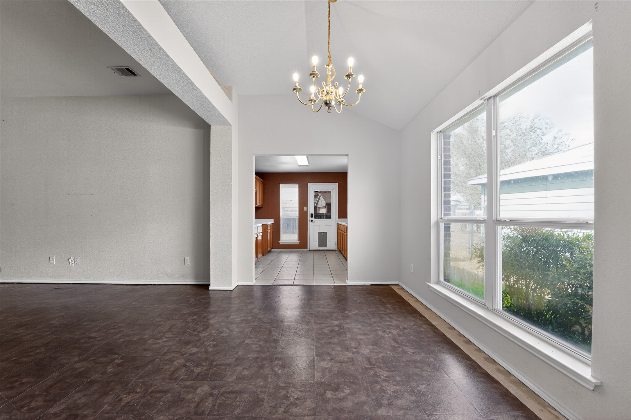152 Eagle Drive Luling, TX 78648 - Photo 13 of 31 Unfurnished dining area featuring suspended lighting and lofted ceiling