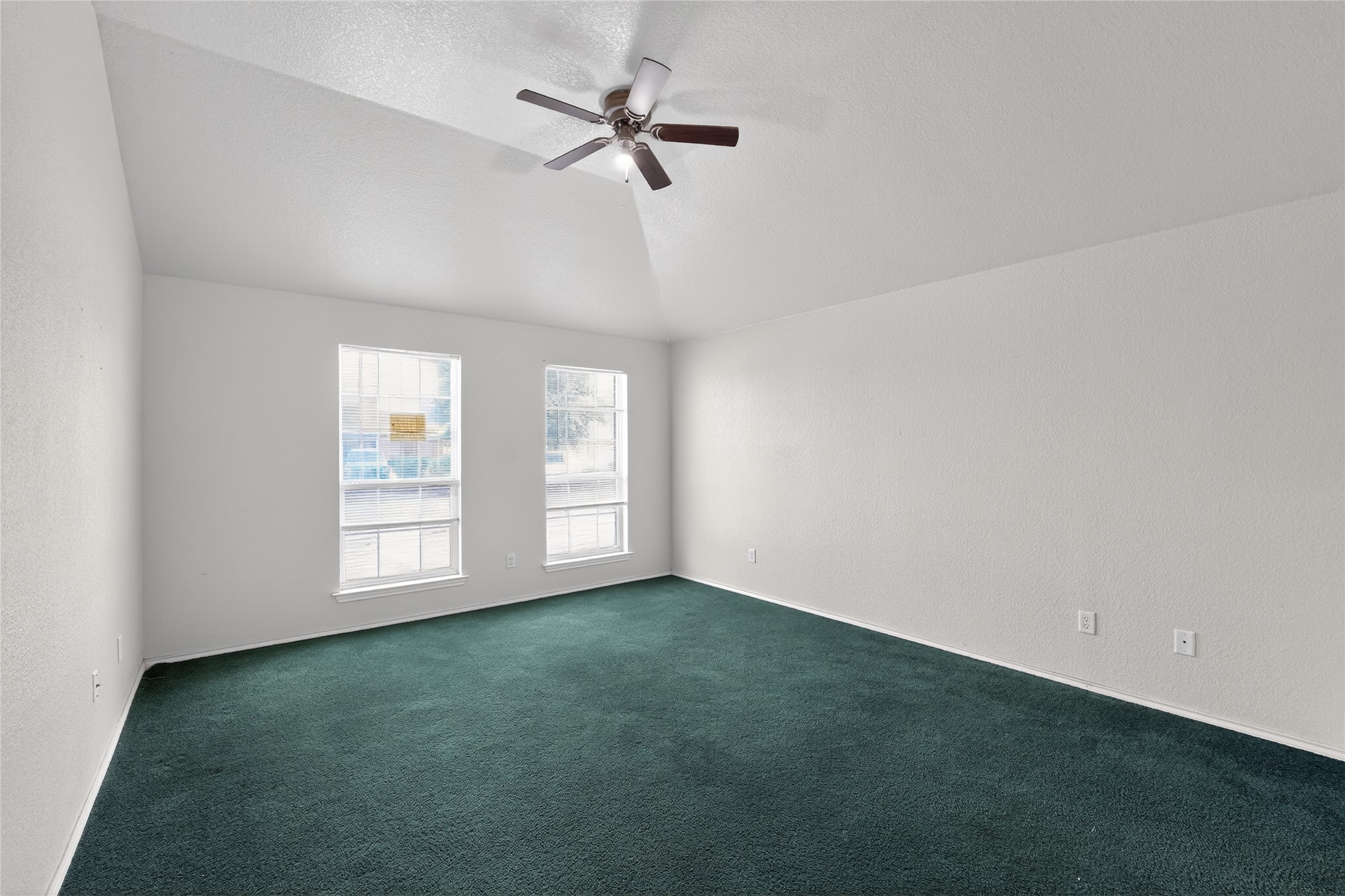 152 Eagle Drive Luling, TX 78648 - Photo 20 of 31 Empty room with a ceiling fan, carpet flooring, and a textured wall