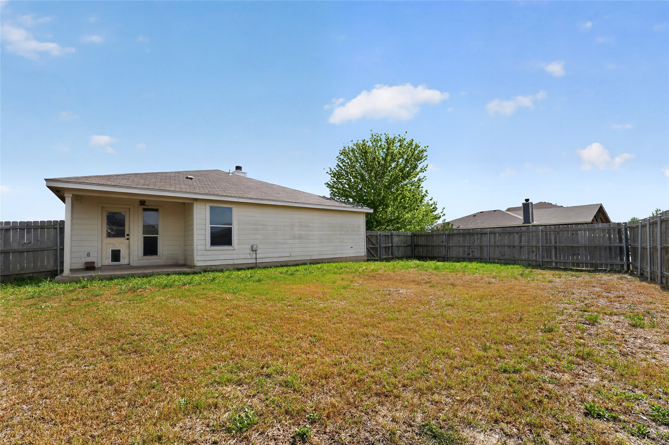 152 Eagle Drive Luling, TX 78648 - Photo 31 of 31 Rear view of property featuring a fenced backyard and a patio