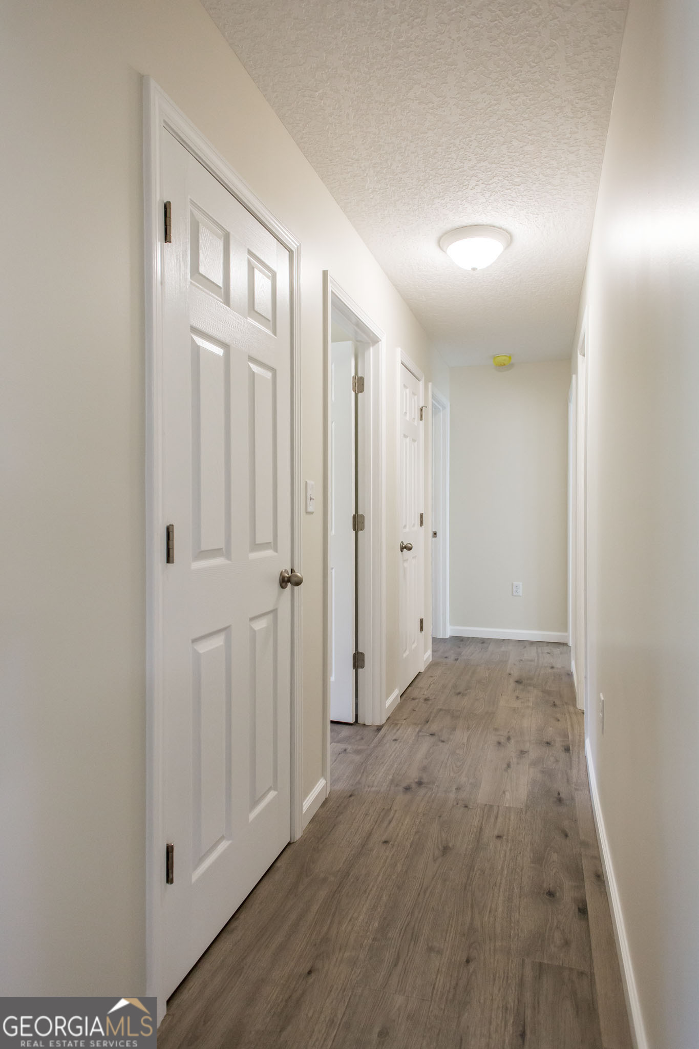 121 Union Street Waycross, GA 31501 - Photo 12 of 25 a view of hallway with wooden floor