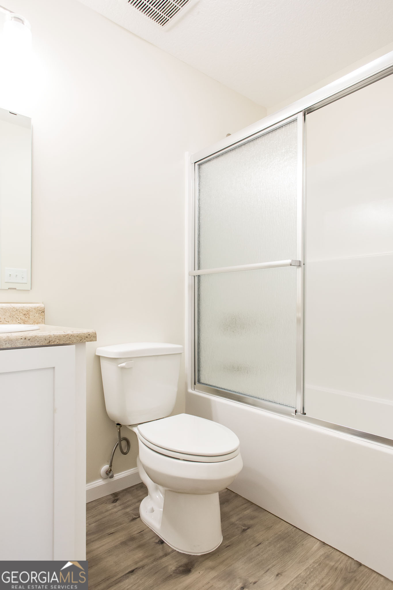 121 Union Street Waycross, GA 31501 - Photo 15 of 25 a white toilet sitting next to a bathroom sink