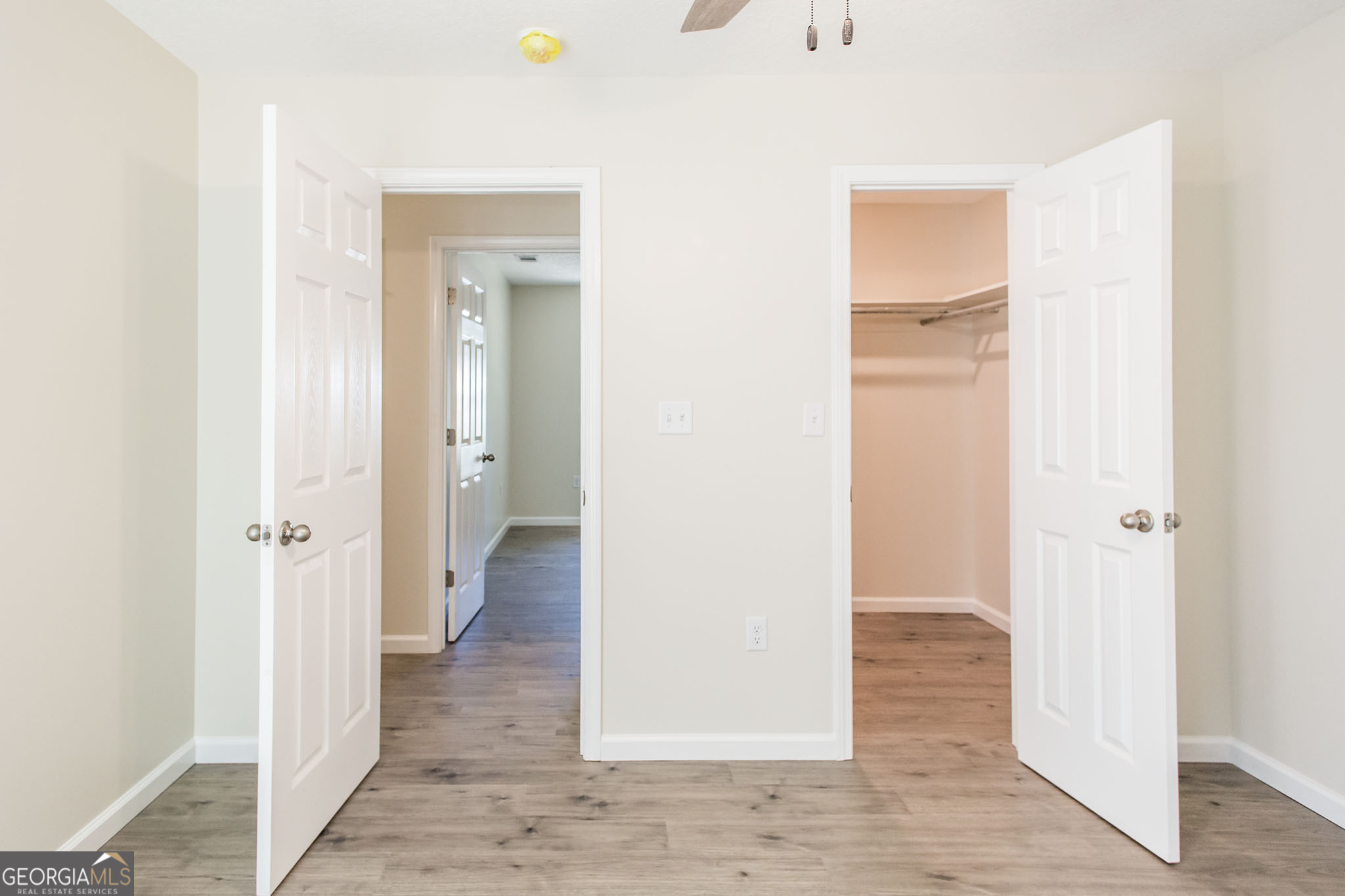 121 Union Street Waycross, GA 31501 - Photo 20 of 25 a view of a hallway with wooden floor