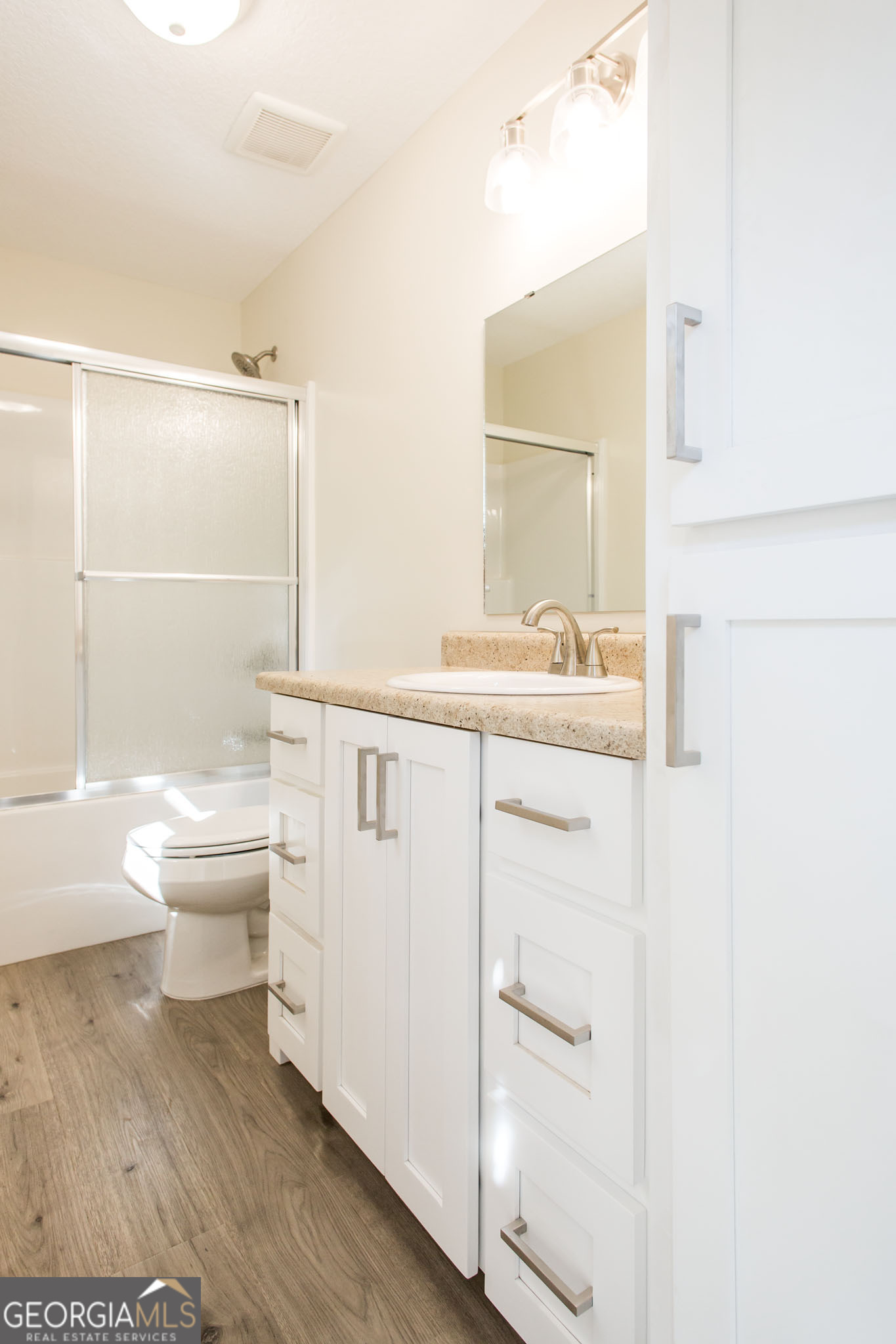 121 Union Street Waycross, GA 31501 - Photo 22 of 25 a bathroom with a sink a toilet and shower