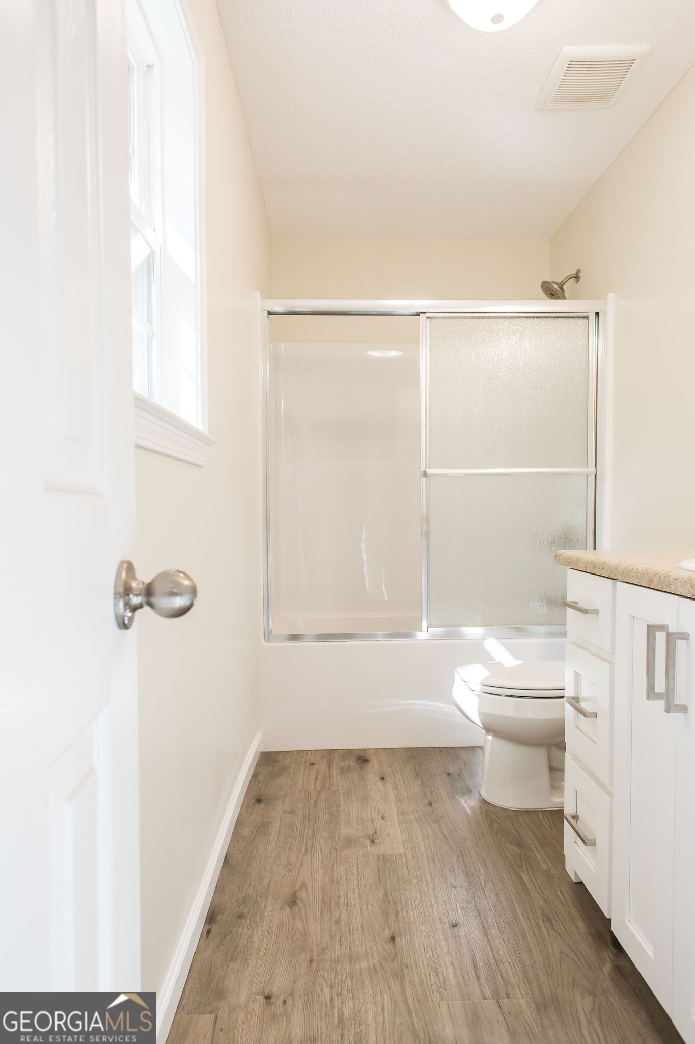 121 Union Street Waycross, GA 31501 - Photo 23 of 25 a bathroom with a toilet a sink and shower
