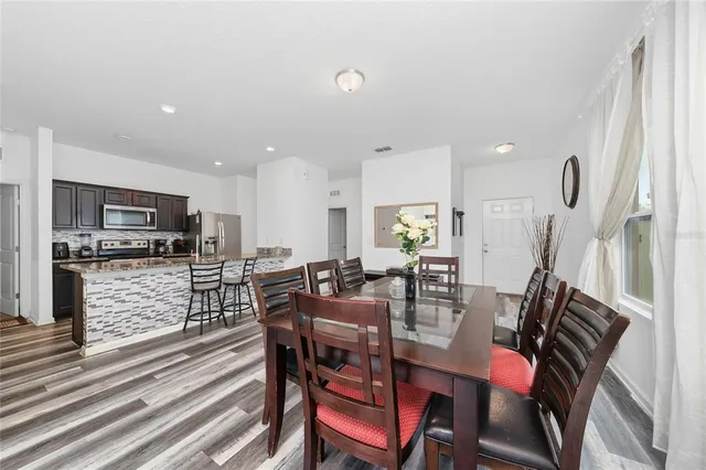 a kitchen with a refrigerator stove and microwave
