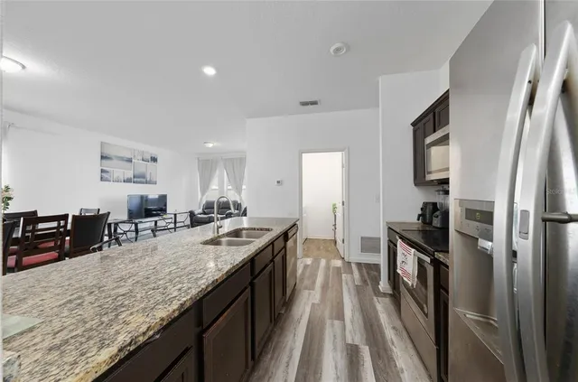 a bed room with a bed and a large window