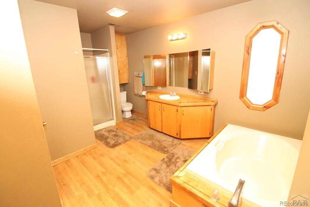148 County Road 378, Unit 378 Rye, CO 81069 - Photo 11 of 35 a bathroom with a sink and a mirror
