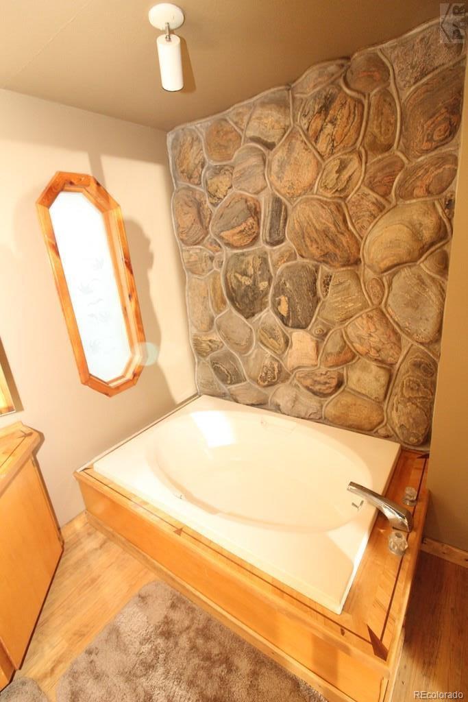 148 County Road 378, Unit 378 Rye, CO 81069 - Photo 13 of 35 a bathroom with a sink and a mirror