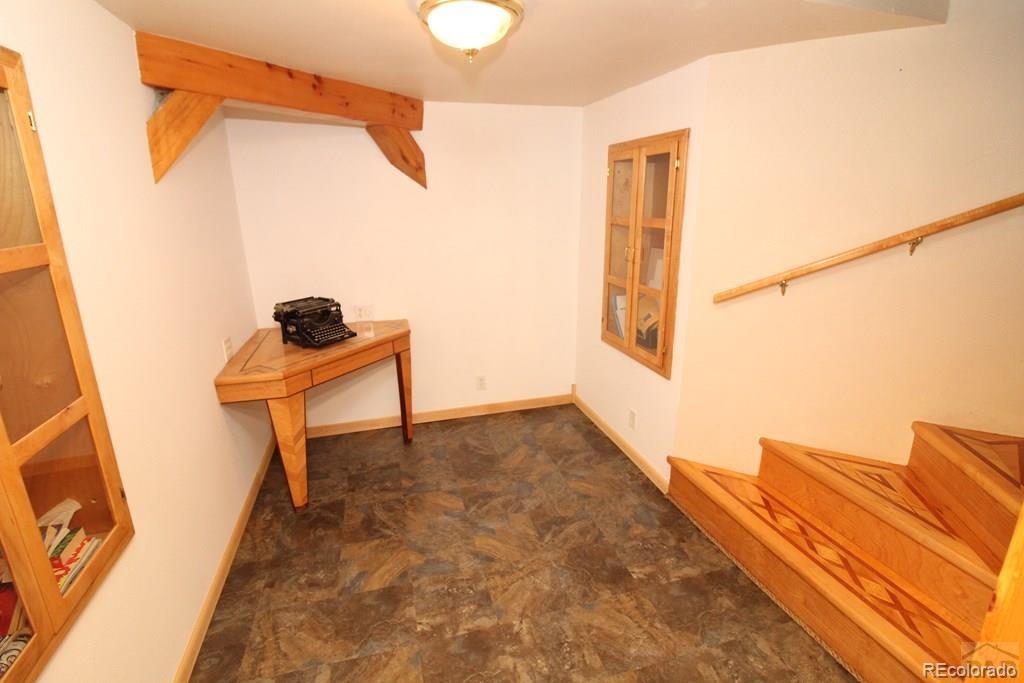 148 County Road 378, Unit 378 Rye, CO 81069 - Photo 15 of 35 a view of a room with wooden floor and windows