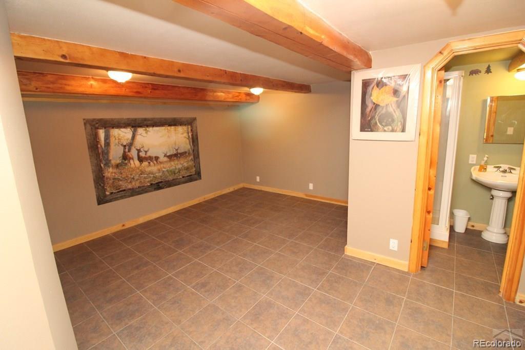 148 County Road 378, Unit 378 Rye, CO 81069 - Photo 16 of 35 a view of a hallway with wooden floor and a large window