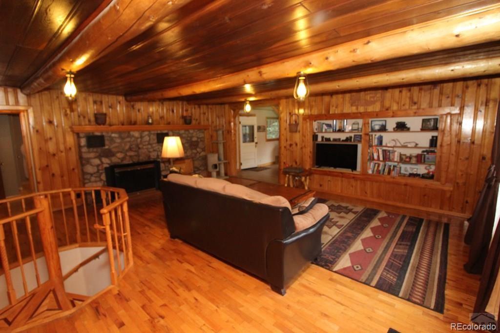 148 County Road 378, Unit 378 Rye, CO 81069 - Photo 2 of 35 a living room with furniture and a flat screen tv
